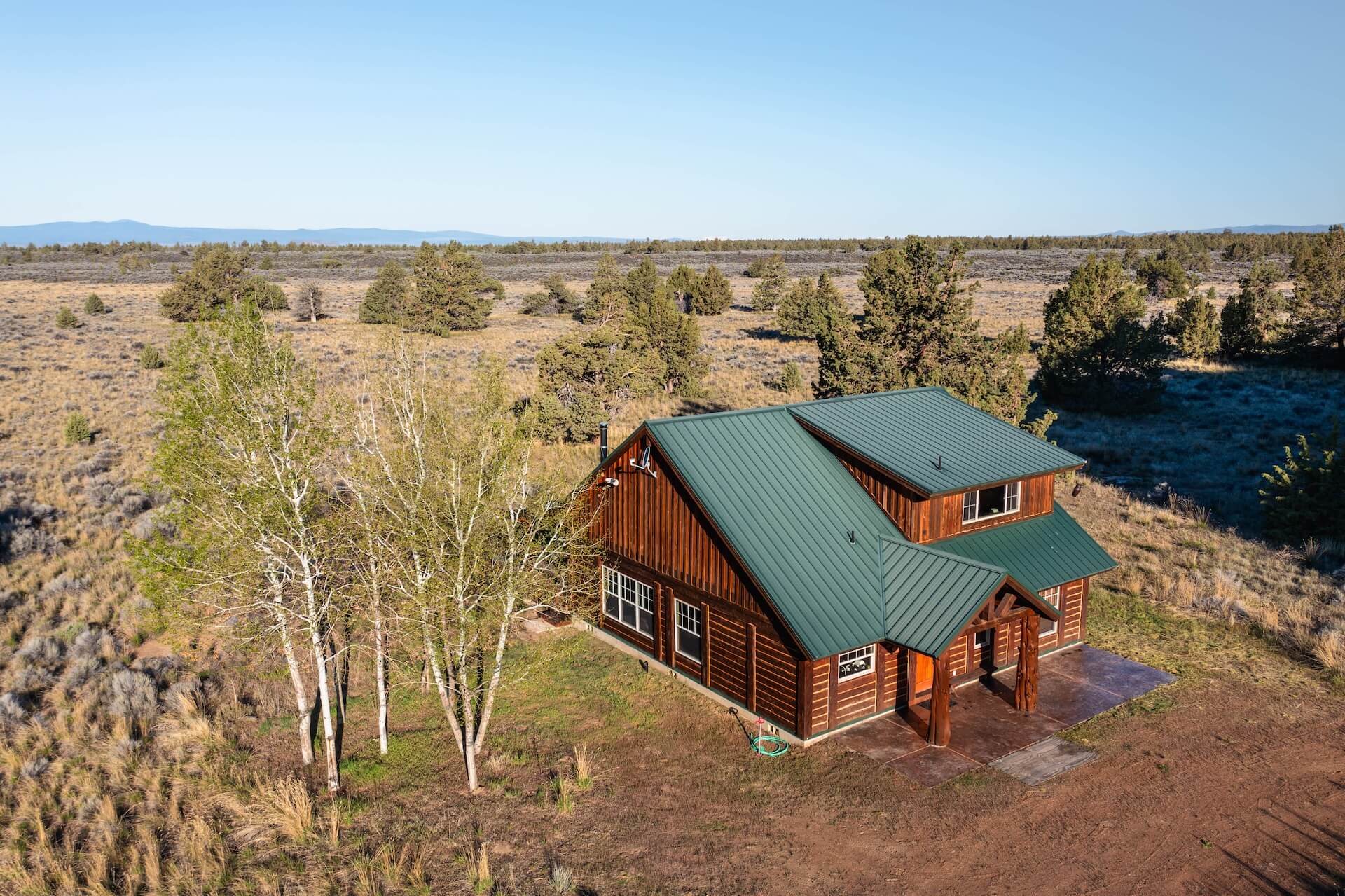 aerial photo of a cabin in the pacific northwest